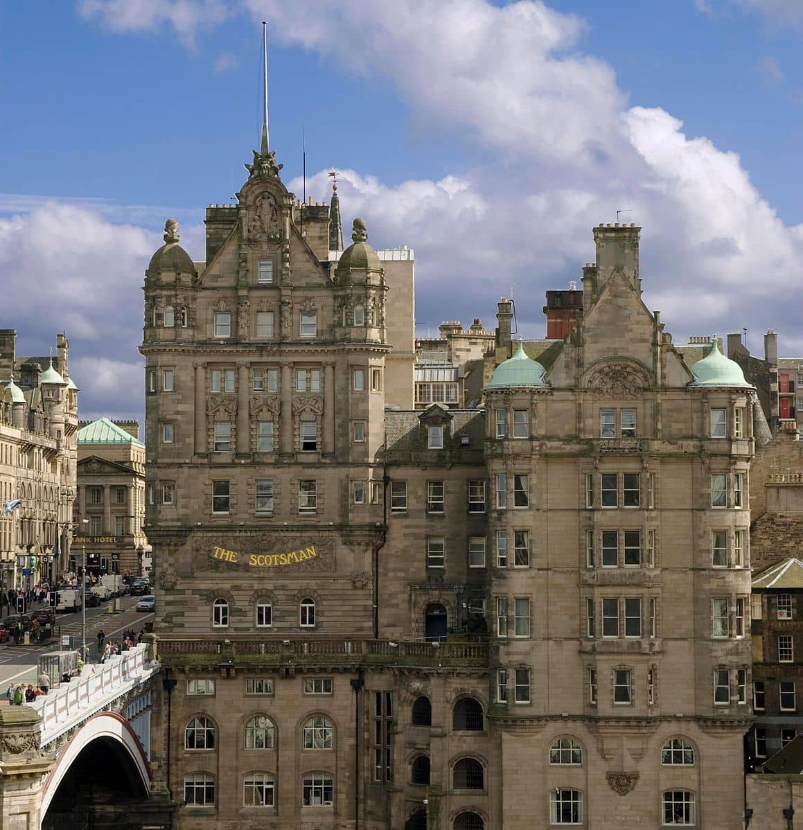 The Scotsman Hotel in Edinburgh housed in a grand historic building with intricate stonework offering luxurious accommodations and stunning views near North Bridge