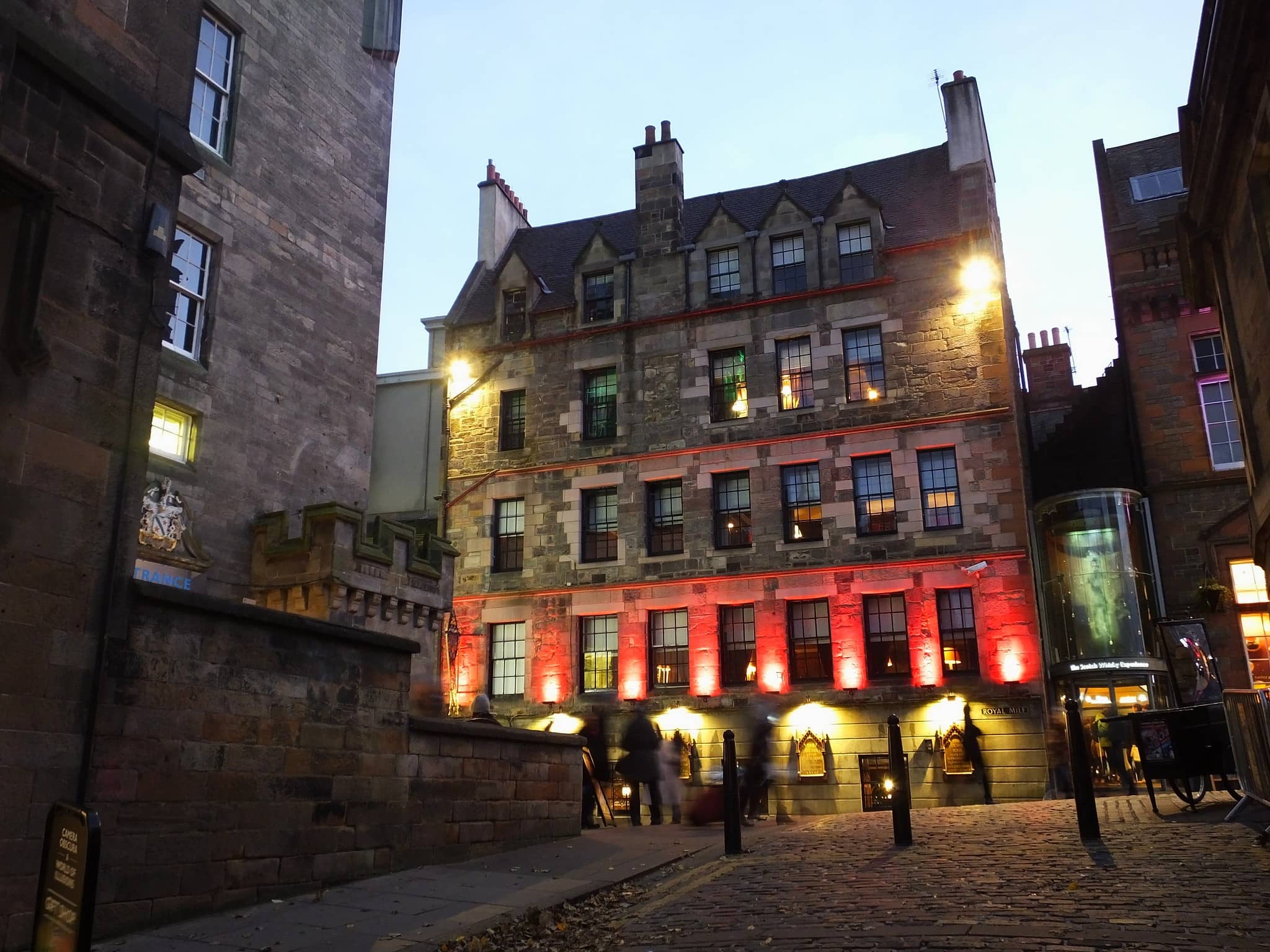 The Witchery by the Castle a historic and atmospheric hotel in Edinburgh illuminated at night with warm red lighting offering a unique and luxurious stay near Edinburgh Castle