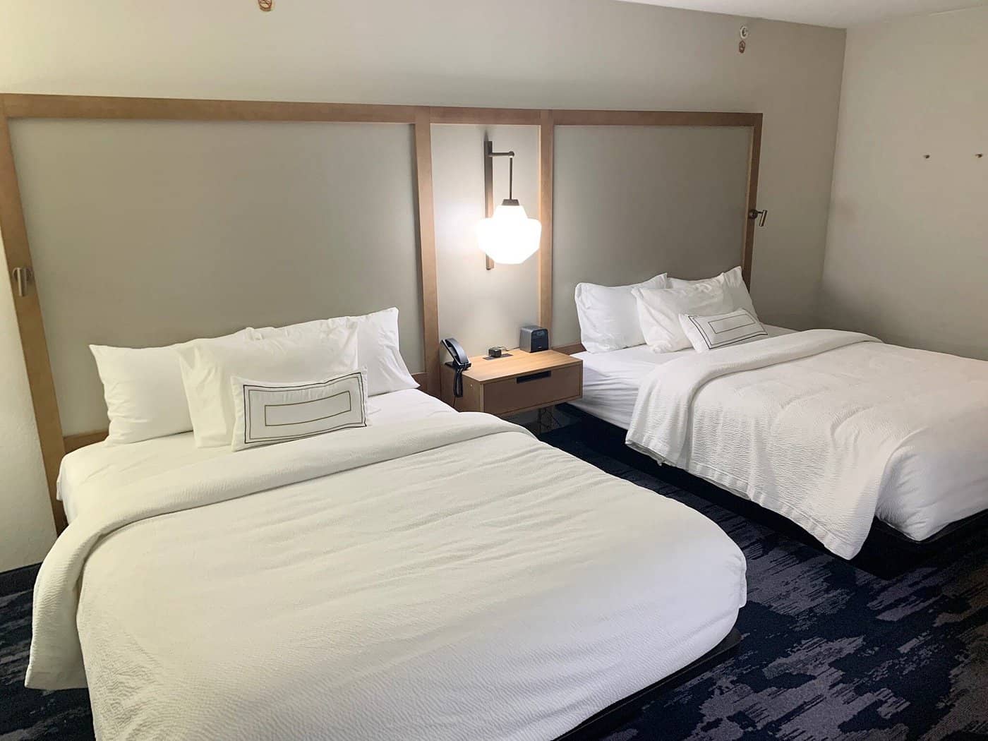 Fairfield Inn  Suites Virginia BeachNorfolk Airport - Comfortable double bed setup in a modern room with minimalist decor near Norfolk Airport