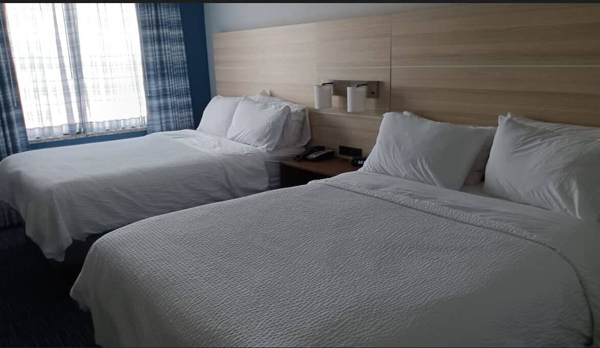 Holiday Inn Express  Suites Norfolk Airport - Spacious double queen room with modern amenities near Norfolk Airport perfect for family stays and business travelers