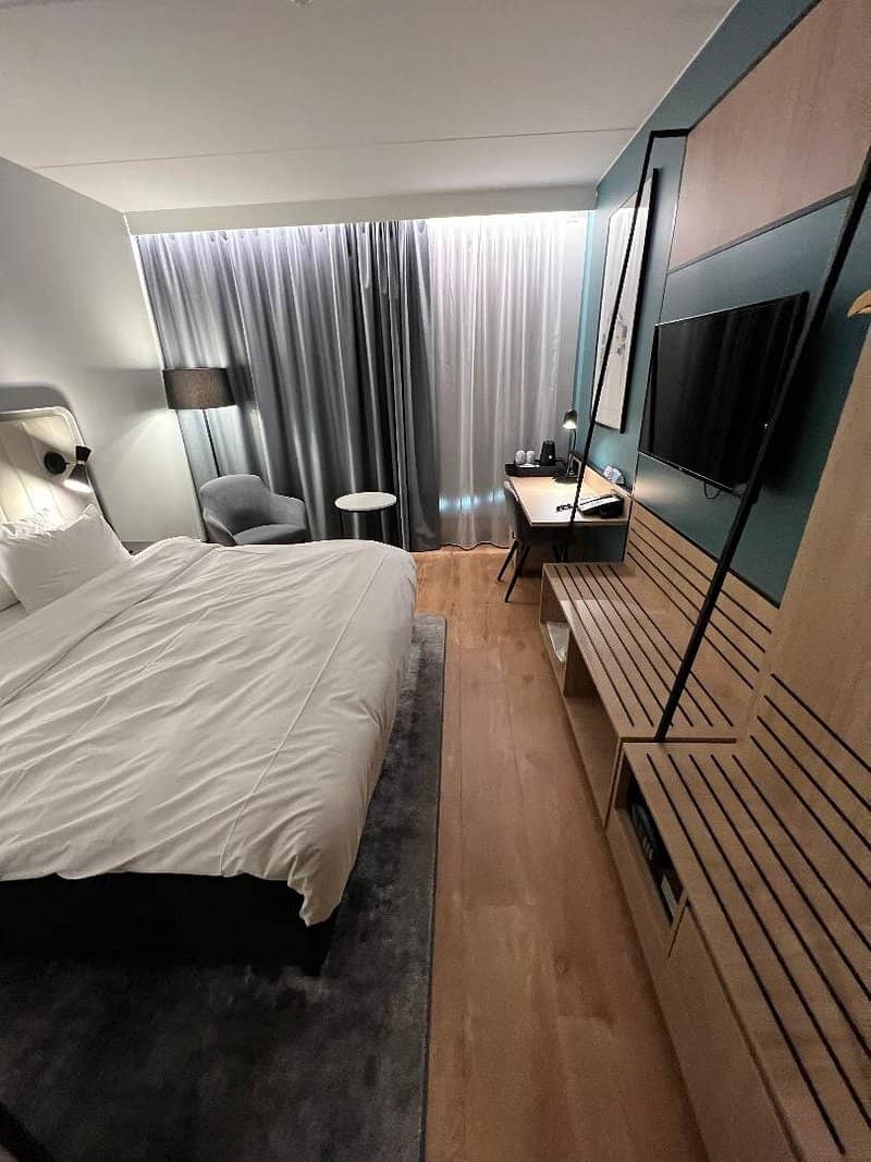 A sleek and modern room at Radisson Blu Hotel and Conference Centre Oslo Alna featuring contemporary decor and amenities designed for comfort and convenience